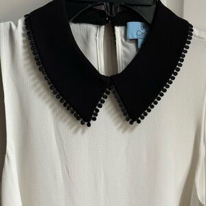 CeCe sleeveless blouse cream w/ black collar.